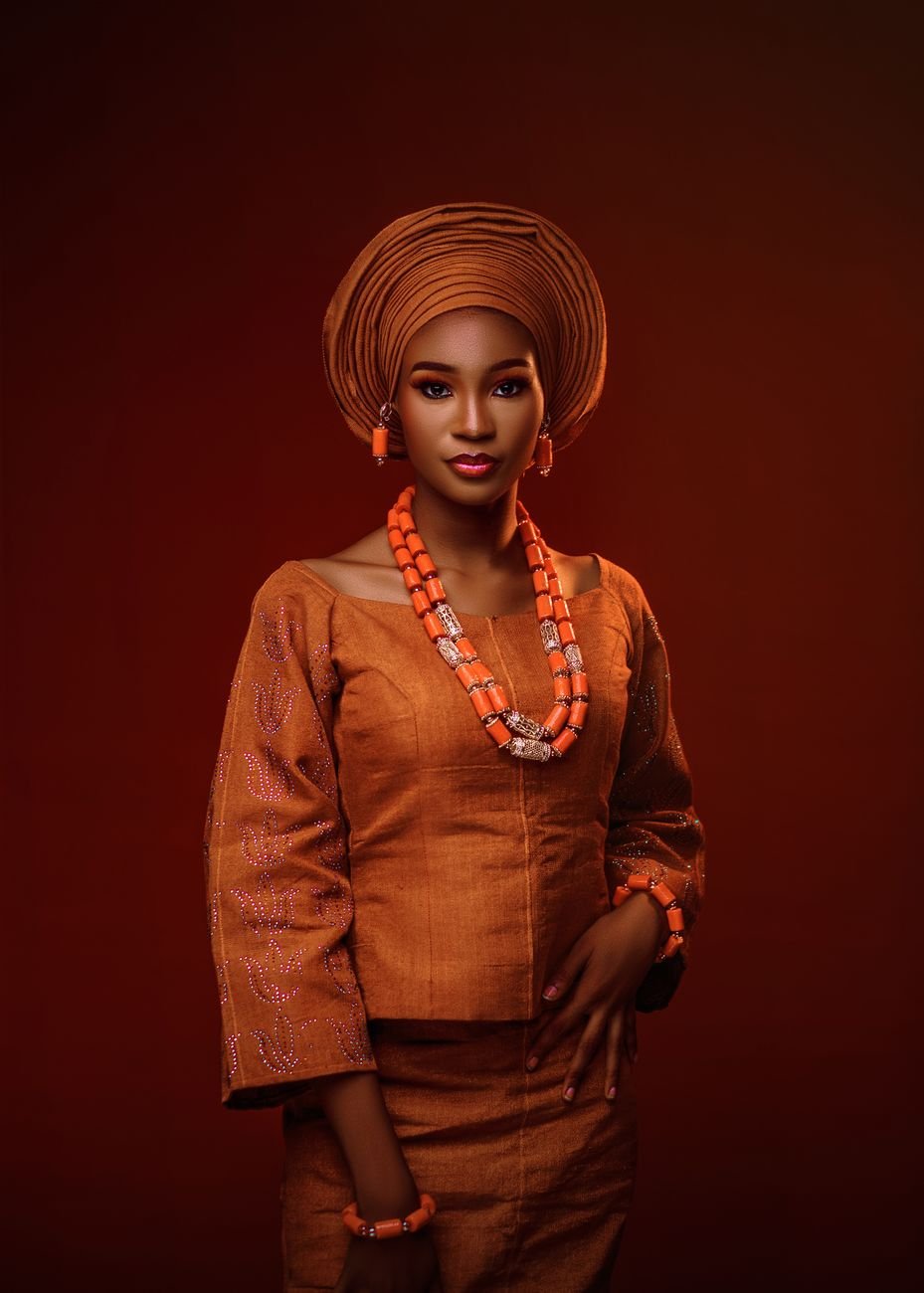 Portrait of an elegant African woman in traditional attire with jewellery and head wrap